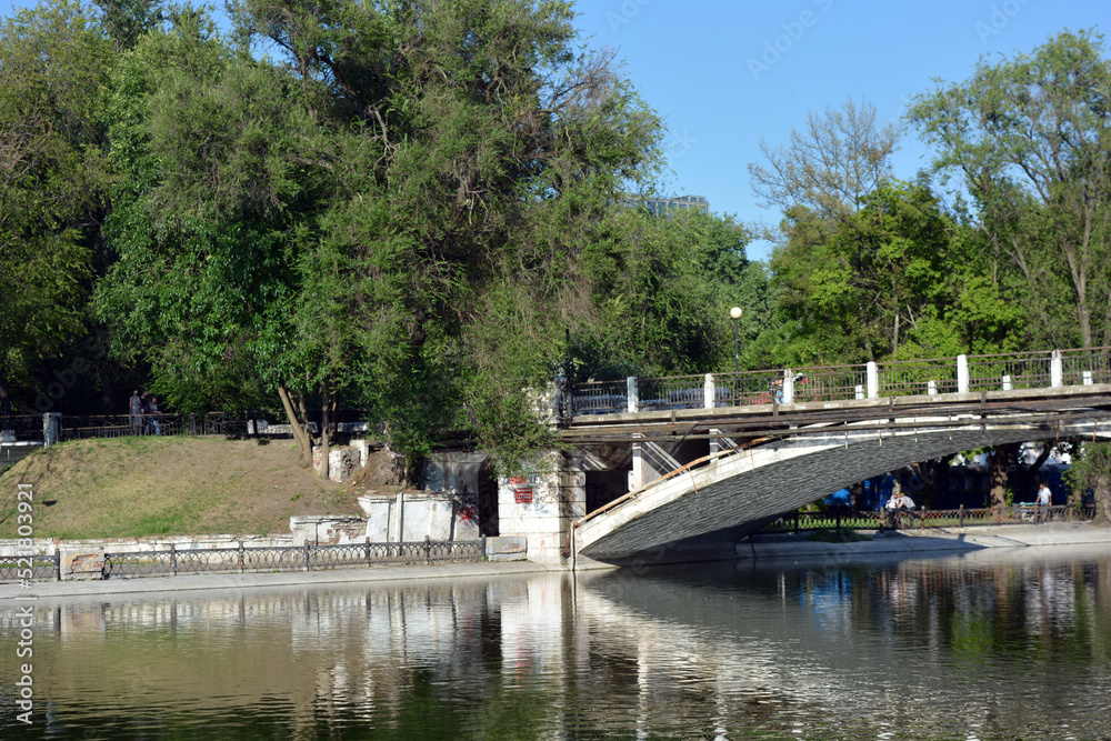 The park has lake, water theatre, bridge, trees, park areas, shops, monuments, protected areas is Lazar Globa Park. Houses, buildings and sights of the city of Dnipro, Ukraine.
