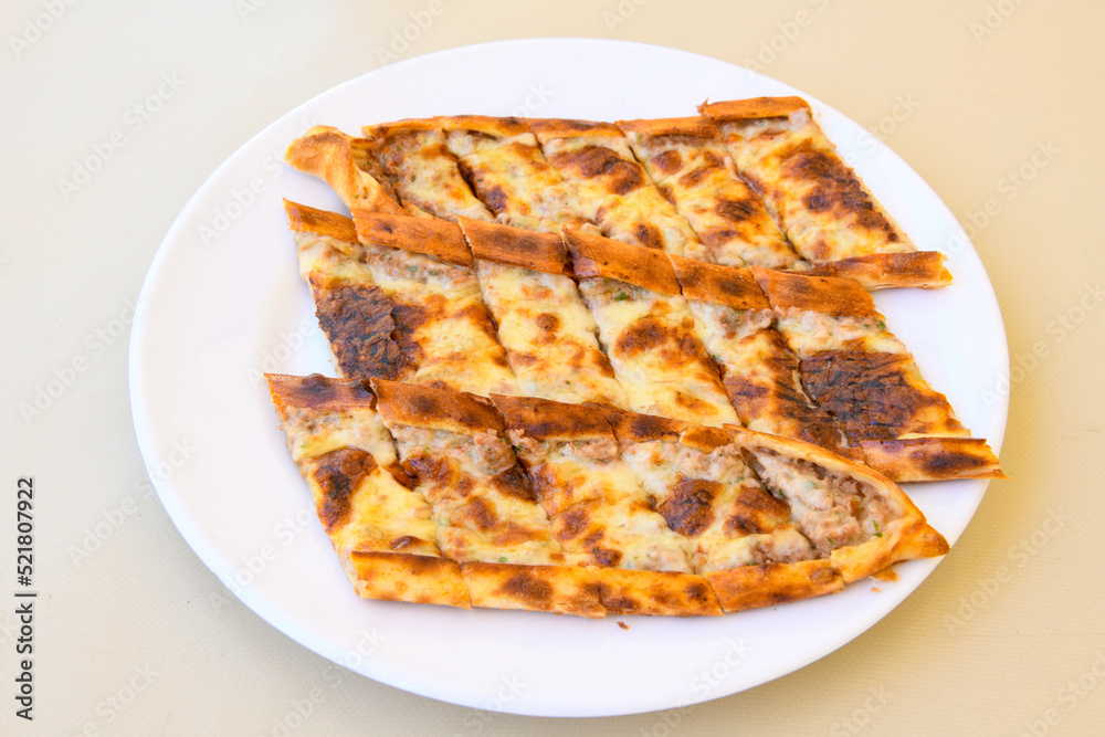 Kiymali pide. Turkish pide with minced meat. Turkish pizza mince pita Pide on white background. Etli ekmek. Kusbasi kasarli pide.