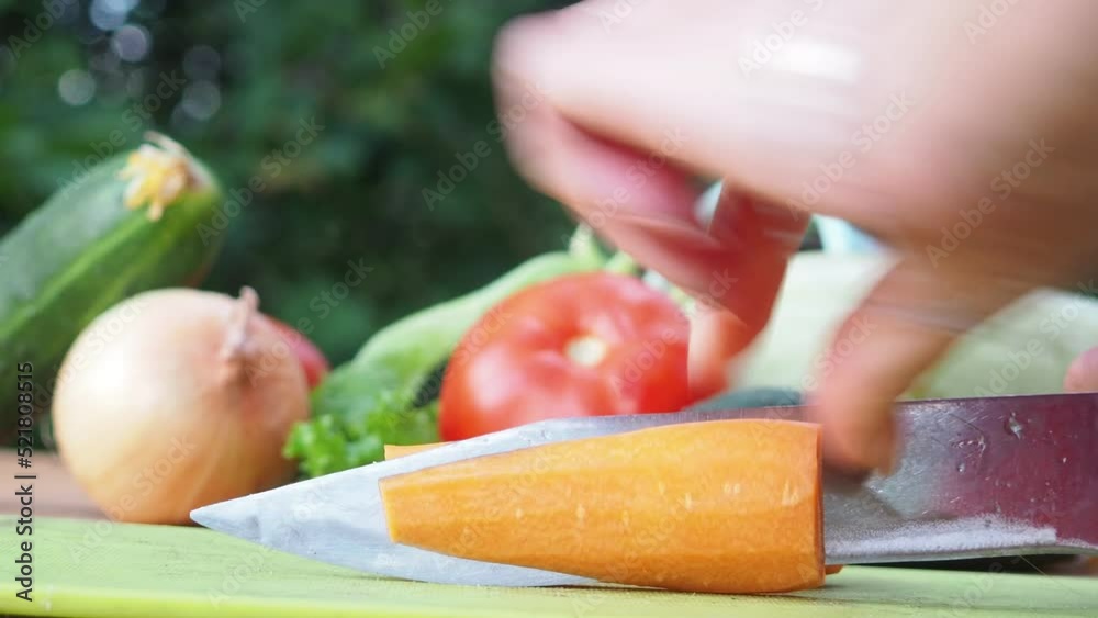 Woman hands cutting vegetables on wooden background. Vegetables cooking ingredients, Prepare salad, dietary food, few calories Woman hands cutting vegetables on wooden background. Vegetables cooking ingredients, Prepare salad, dietary food, few calories