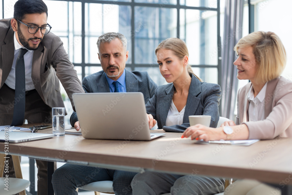 Group of business partners discussing ideas and planning work in office. Group of business partners discussing ideas and planning work in office.
