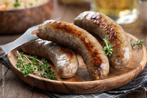 Fried bratwurst garnishrd with thyme