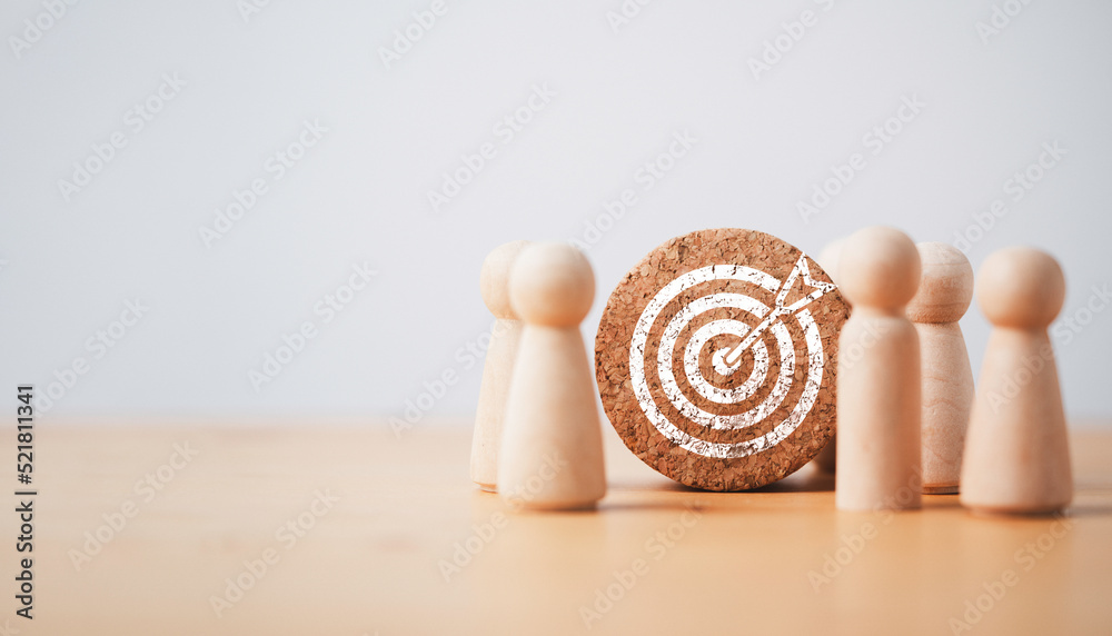 Wooden miniature figures standing with dartboard and arrow for setup business objective target and goal concept. - obrazy, fototapety, plakaty 