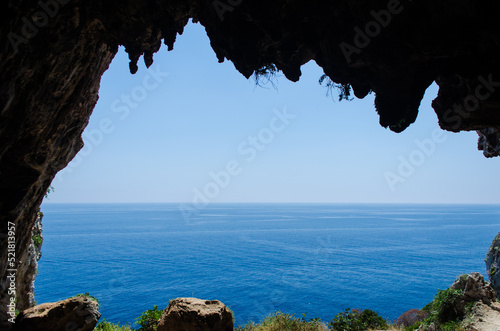 Il panorama del Mar Mediterraneo visto dalla grotta   delle Cipolliane lungo la costa del Salento fra Marina di Novaglie e il Ciolo photo