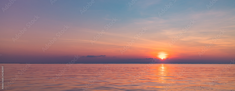 Beautiful sunset beach seascape, summer vacation holiday template banner. Calm waves with amazing blue ocean lagoon, sea shore, coastline. Amazing inspirational view. Relaxing bright beach seaside
