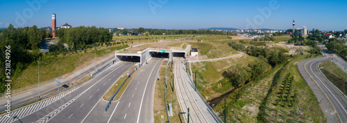 New highway in Krakow, called Trasa Łagiewnicka with multilane road with tunnels for cars and trams, to be opened in July 2022. Part of the ring road around Cracow city center. Aerial panorama