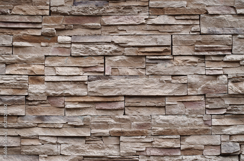 Colorful relief tiles imitating stone on wall close Colorful relief tiles imitating stone on wall close