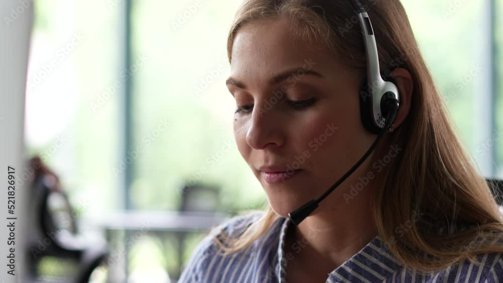 Young woman customer care support service agent call center operator in wireless headset talk consult online client using computer solving complaints on helpline or sell services in telesales office