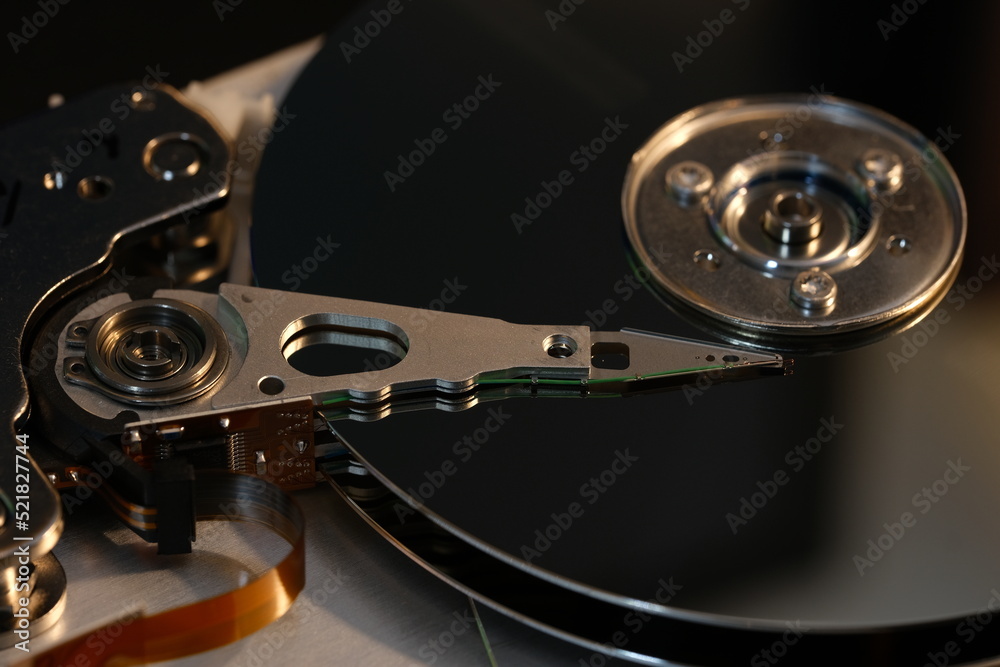 Inside of internal Harddrive HDD , Disassembled hard drive from the computer data hard drive backup disc hdd disk restoration restore recovery engineer Inside of internal Harddrive HDD , Disassembled hard drive from the computer data hard drive backup disc hdd disk restoration restore recovery engineer