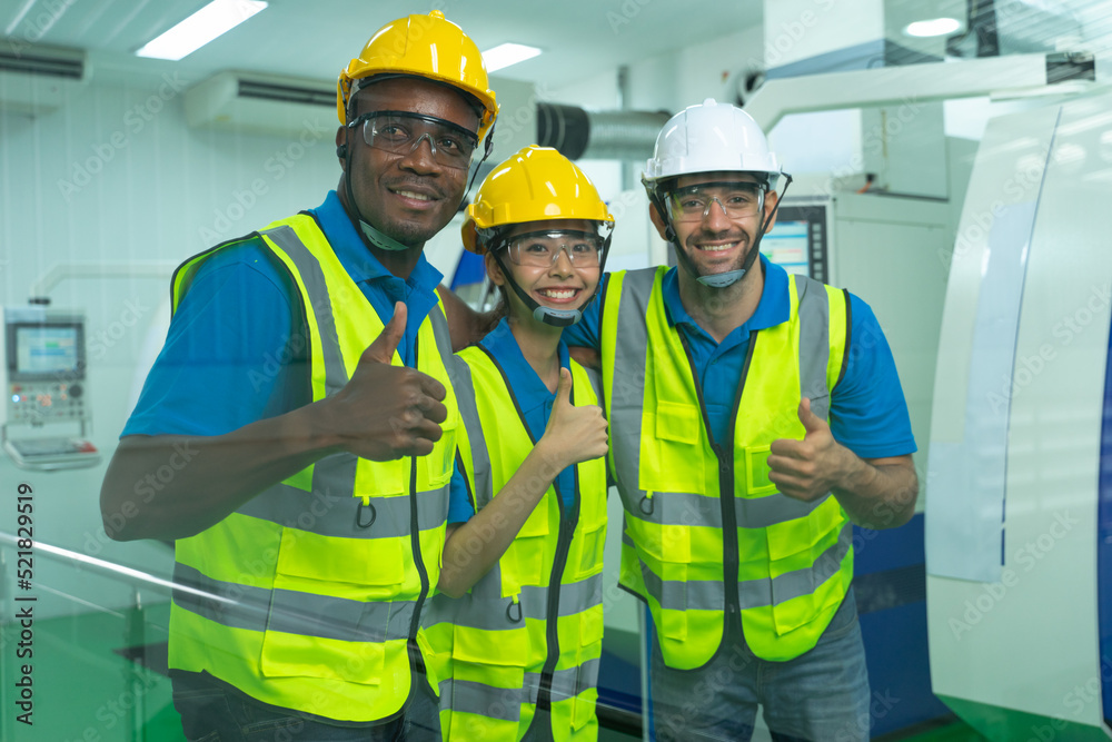 Group of young multiethnic confident male and female Engineers and Worker in safety uniform and helmet. Successful business and teamwork Group of young multiethnic confident male and female Engineers and Worker in safety uniform and helmet. Successful business and teamwork