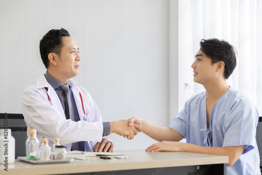 Professional doctor interacting consulting with young male patient at clinic, Male patient get advice about medicine from doctor at hospital Professional doctor interacting consulting with young male patient at clinic, Male patient get advice about medicine from doctor at hospital