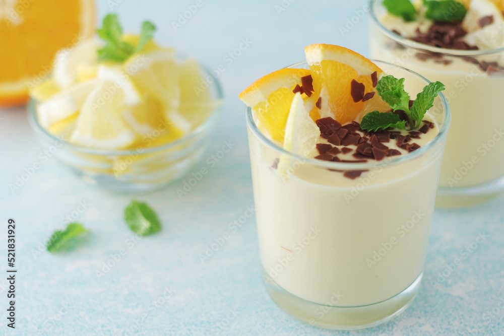 Orange lemon citrus milk mousse in glasses Orange lemon citrus milk mousse in glasses