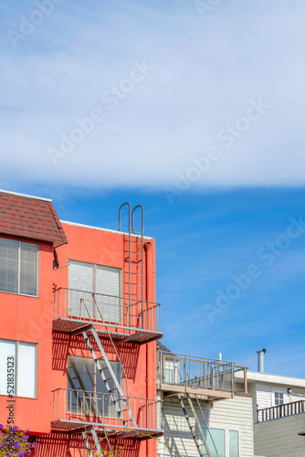 View of an apartment buildings at San Francisco, California with metal emergency staircase outdoors © Jason