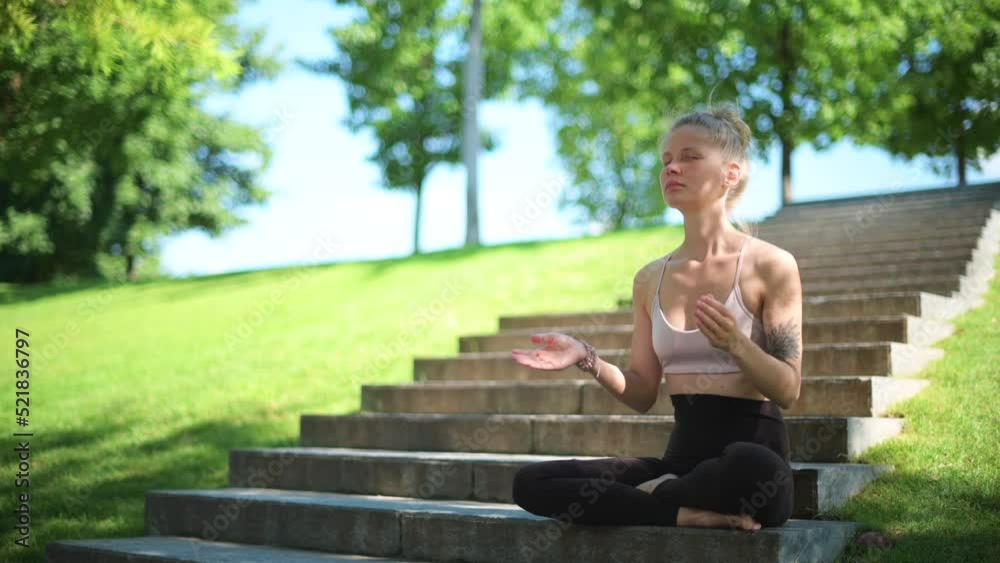 Girl practice yoga meditation outdoor in park Girl practice yoga meditation outdoor in park