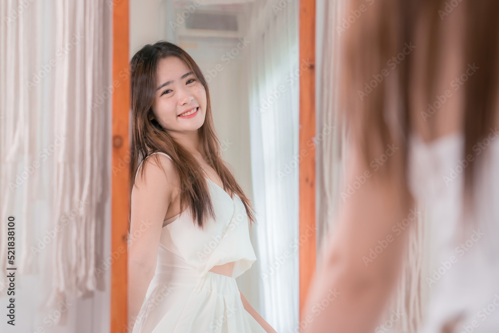Asian woman choosing clothes dress-up mirror at home fashion lifestyle, Shopping concept. Asian woman choosing clothes dress-up mirror at home fashion lifestyle, Shopping concept.