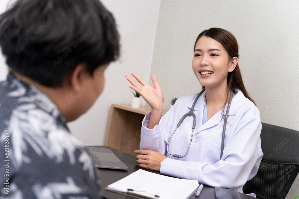 A beautiful Asian doctor discusses the condition of a male patient being hospitalized. A beautiful Asian doctor discusses the condition of a male patient being hospitalized.
