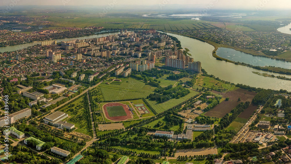 western outskirts of the city of Krasnodar (South of Russia) - the stadium of the agricultural university, the districts of Selkhoz, Novy Gorod and Yubileiny - aerial view panorama on a summerday