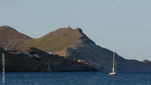 boat on the beach of los genoveses at sunset, cabo de gata, almeria