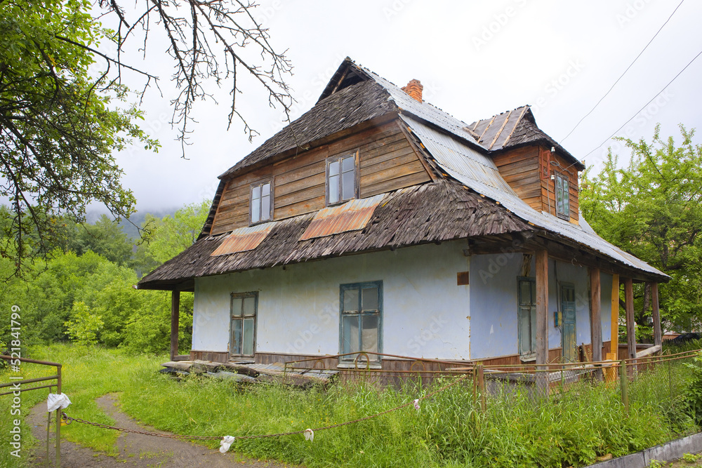 Wooden house in rainy day in Yaremche, Ukraine	