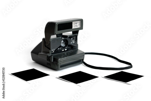 An old retro polaroid camera for instant photographing on a white background.