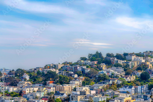 Rows of residential buildings with trees outdoors in San Francisco, California © Jason