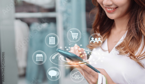 Beautiful asian woman use smartphone searching shop ratail in the commercial district modern city, Online shoping futuristic concept.