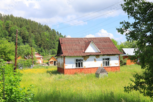Wooden house in sunny day in Yaremche, Ukraine