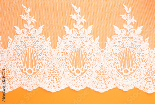 White laces on orange background isolated horizontally