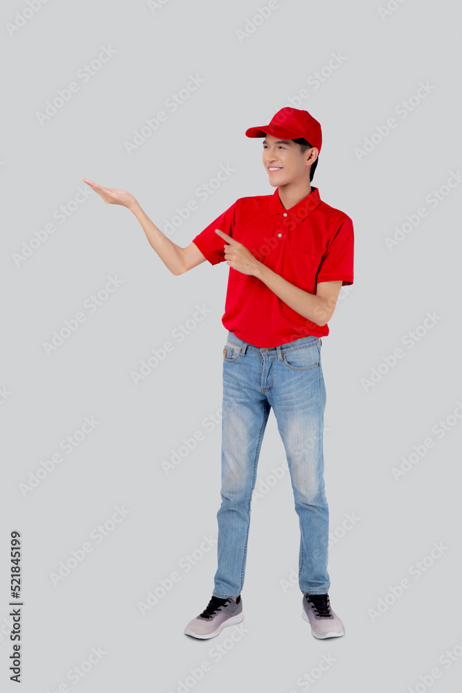 Young asian man in uniform red and cap standing presenting with excited isolated on white background, employee or dealer show, courier and delivery, deliveryman and expression, logistic and cargo. Young asian man in uniform red and cap standing presenting with excited isolated on white background, employee or dealer show, courier and delivery, deliveryman and expression, logistic and cargo.