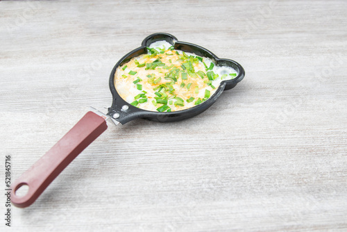 Fun food for kids. omelet for children in a frying pan. Healthy eating.