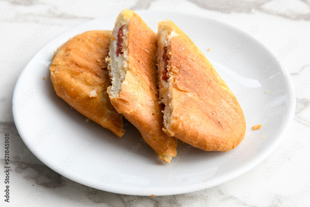 Turkish karisik atom tost ( kasarli bazlama tost) . Flat baked bread toasted Turkish karisik atom tost ( kasarli bazlama tost) . Flat baked bread toasted