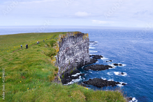 Very high cliff in the area north of the fjords in Iceland during a cloudy day