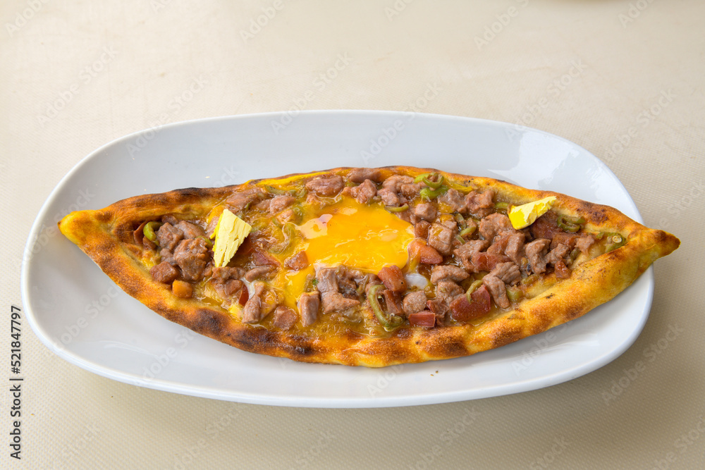 Turkish pita with minced cubed meat and cheese (Turkish name: Kiyma Kusbasi kasarli pide) Turkish pita with minced cubed meat and cheese (Turkish name: Kiyma Kusbasi kasarli pide)