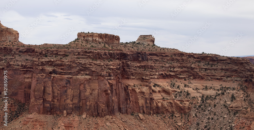Scenic American Landscape and Red Rock Mountains in Desert Canyon. Spring Season. Canyonlands National Park. Utah, United States. Nature Background. Scenic American Landscape and Red Rock Mountains in Desert Canyon. Spring Season. Canyonlands National Park. Utah, United States. Nature Background.