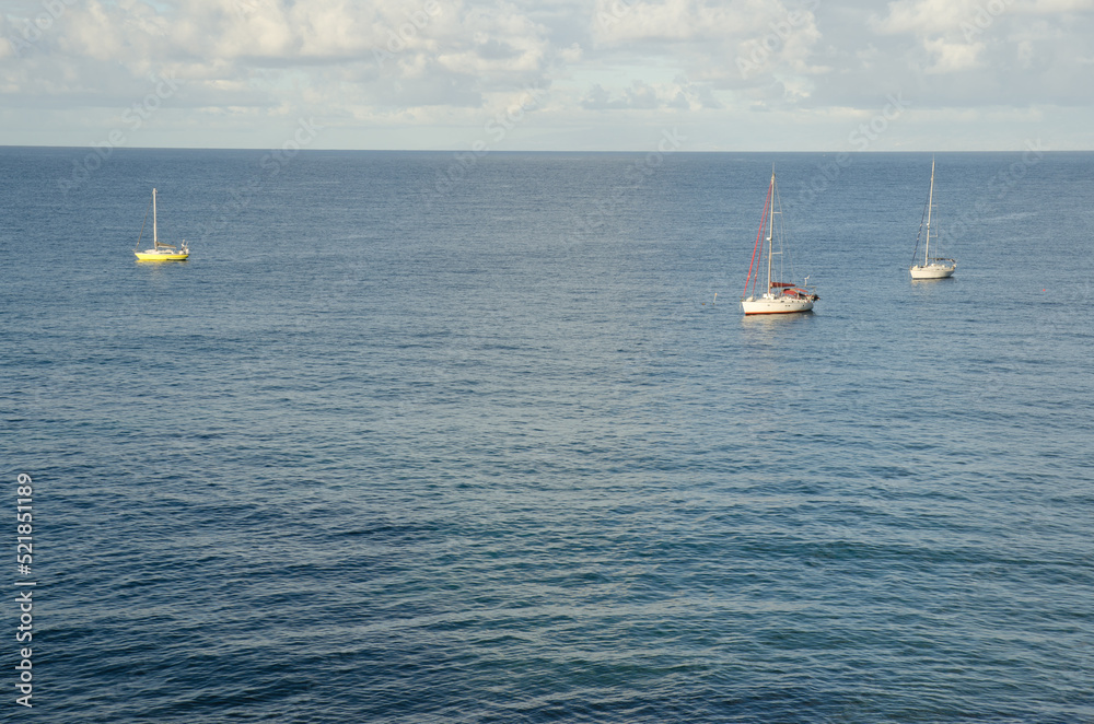 Fototapeta premium Yachts moored along the coast. Sardina del Norte. Galdar. Gran Canaria. Canary Islands. Spain.
