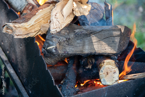 fire  wood in a black grill