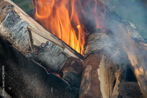 fire  wood in a black grill