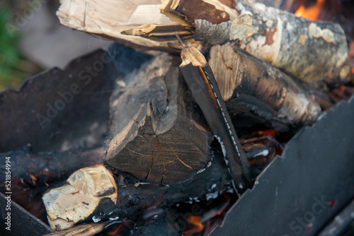 wood in a black grill