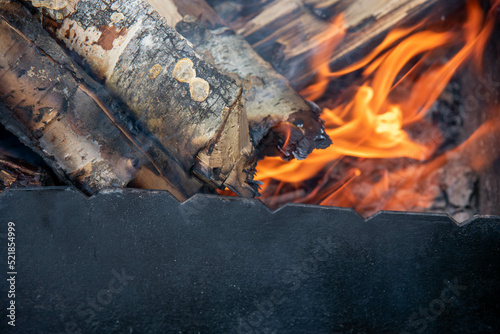 fire  wood in a black grill