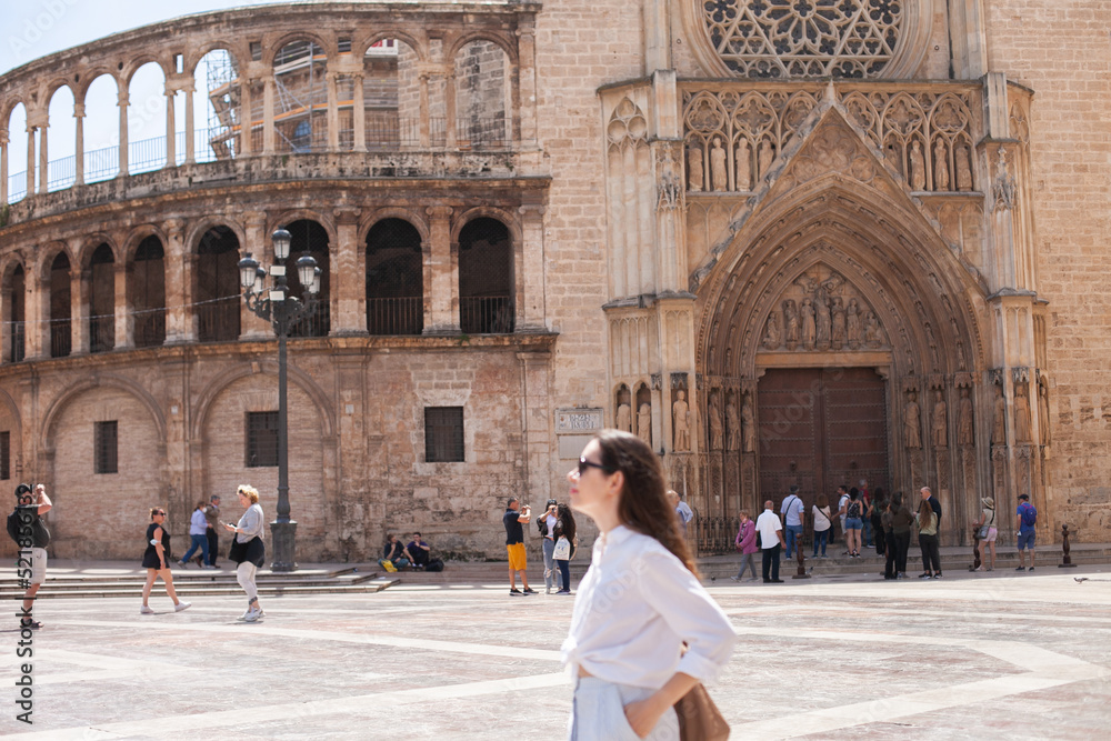 Female tourist in Valencia, Spain. Young woman sightseeing in the central historic square in Europe.