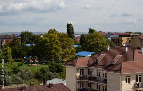 View of the beautiful buildings from the Ferris wheel in the village of Vityazevo in summer photo