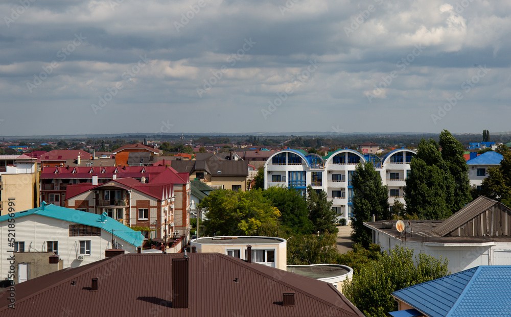 View of the beautiful buildings from the Ferris wheel in the village of Vityazevo in summer