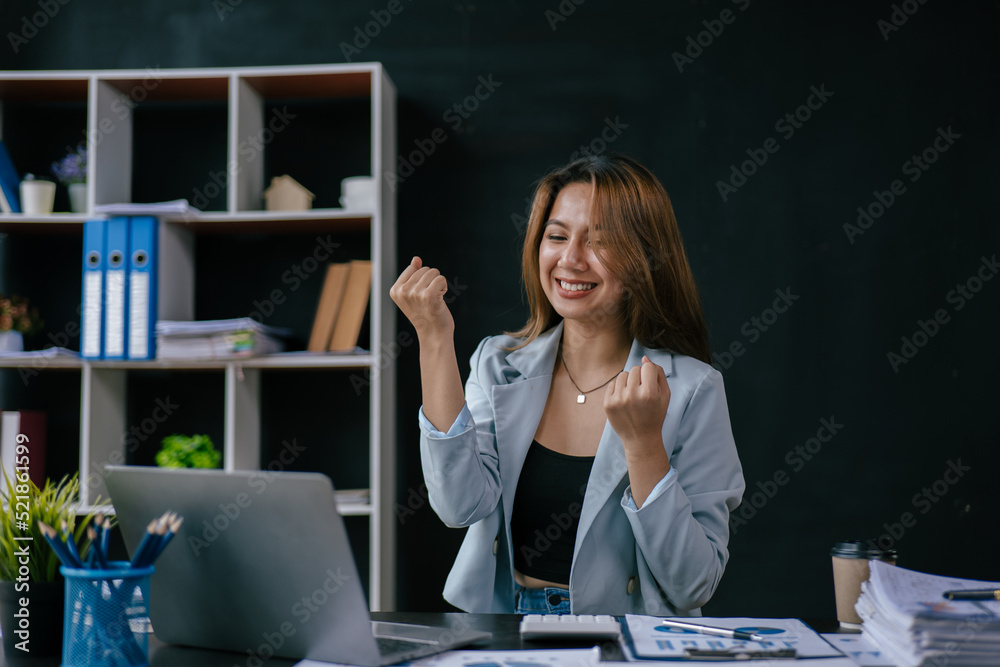 Business woman happy and cheerful for successful on project via laptop in office space. Business woman happy and cheerful for successful on project via laptop in office space.