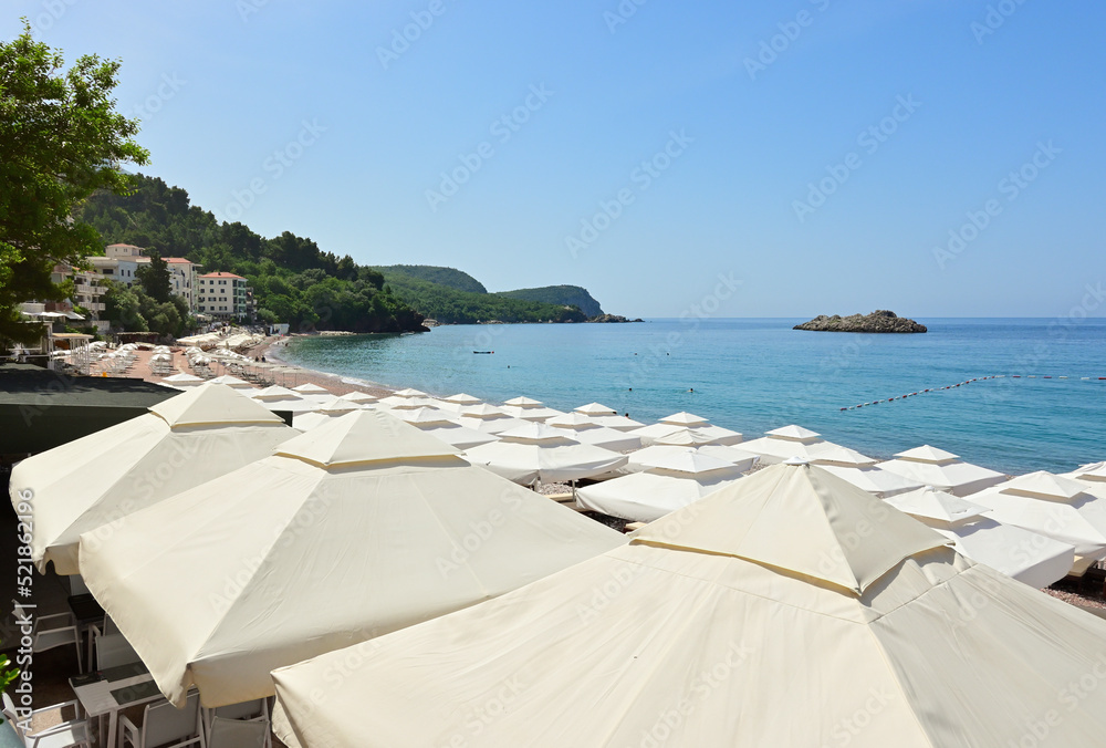 Umbrellas on Sveti Stefan beach, one of the most beautiful beaches in Montenegro. Europe