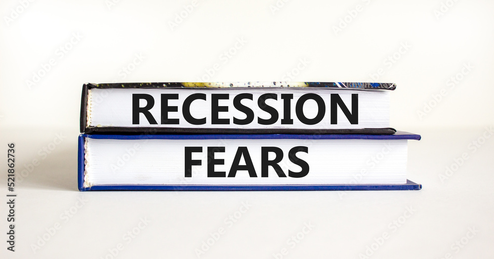 Recession fears symbol. Concept words Recession fears on books on a beautiful white table white background. Business and recession fears concept. Copy space.