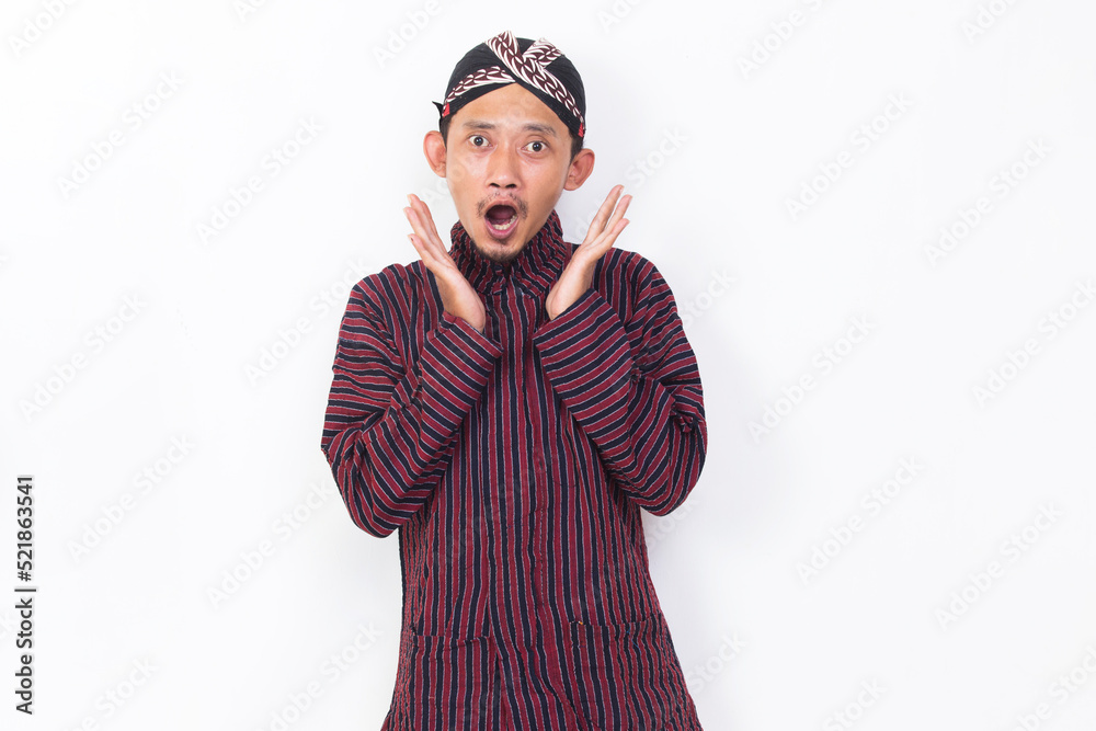 asian man with javanese traditional cloth lurik shocked isolated on white background asian man with javanese traditional cloth lurik shocked isolated on white background