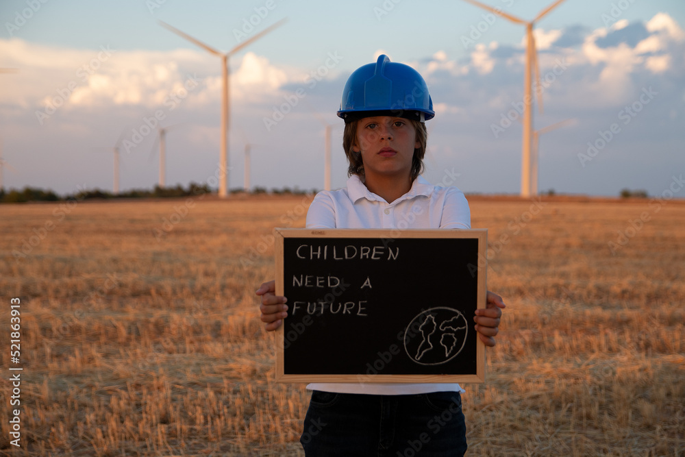 engineer with a turbine. Child engineer studies and analyses the wind ...