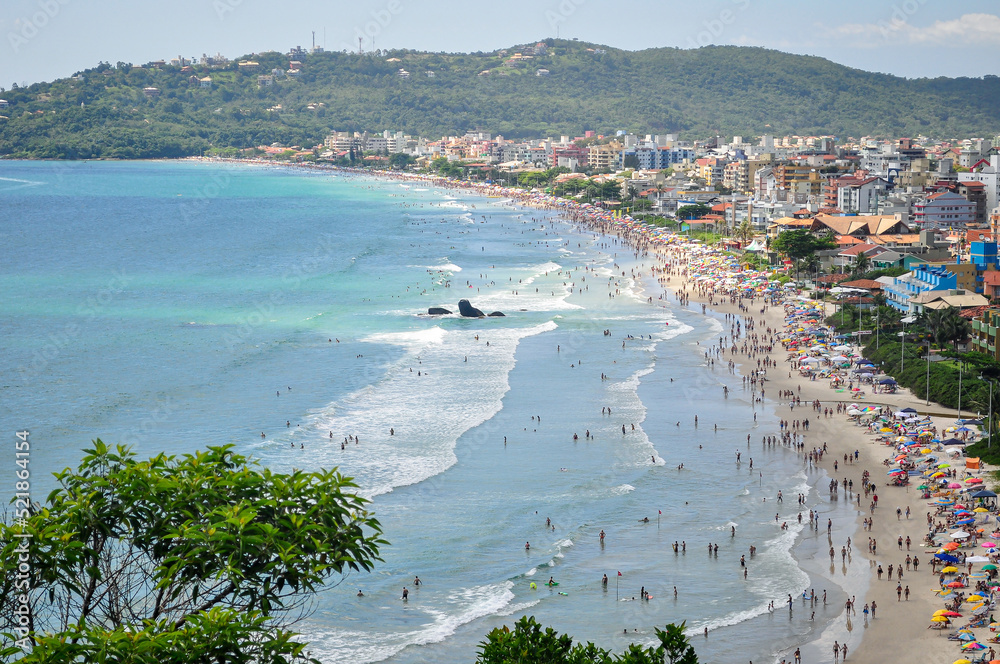 Beautiful view from the top of a hill of Bombas and Bombinhas beach, Santa Catarina state, Brazil. Crowded beach in a summer day