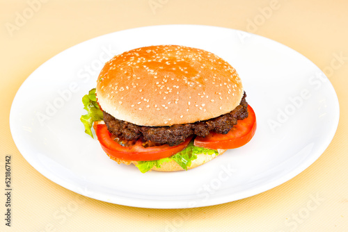 Big tasty  burger with beef cutlet on a plate. Hamburger.