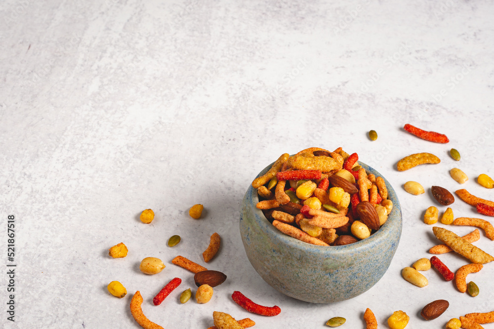 Fototapeta premium Spicy BBQ trail mix in a bowl on a light and airy background wit