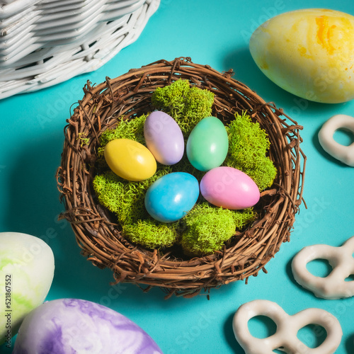 Colorful jordan almonds nestled into a nest with Easter eggs and